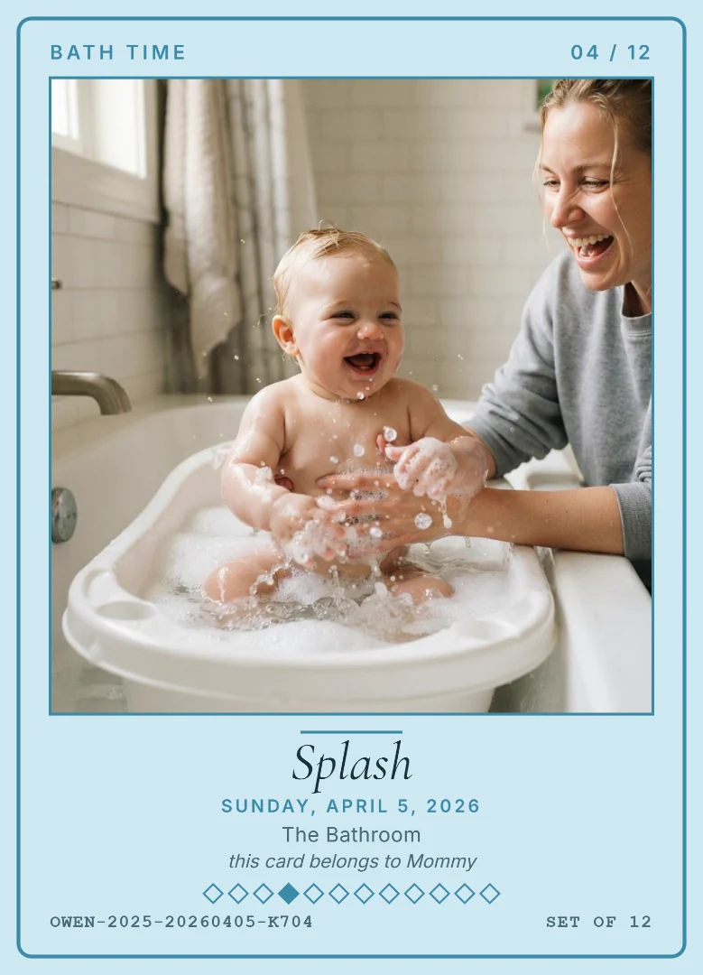 A four-month-old baby splashing in a little tub with bubbles while his mother laughs, on a sky blue keepsake card