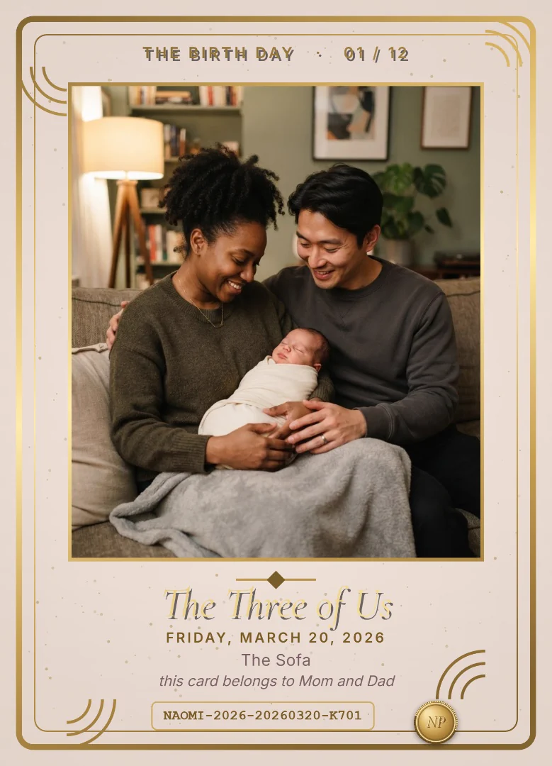 A mother and father smiling at their swaddled newborn on a sofa under a grey blanket, on a dusty rose and gold keepsake card
