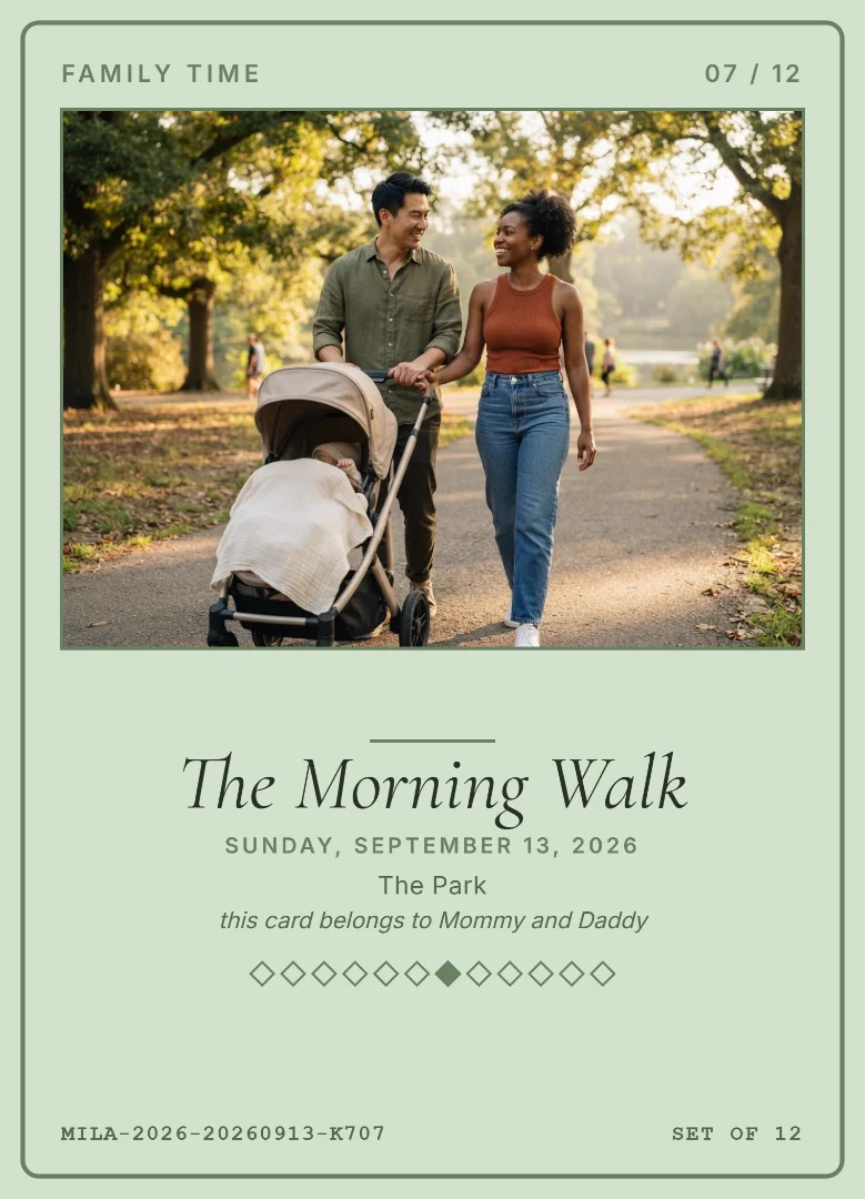 A father and mother smiling at each other as they push their baby&rsquo;s stroller along a tree-lined park path, on a sage green keepsake card